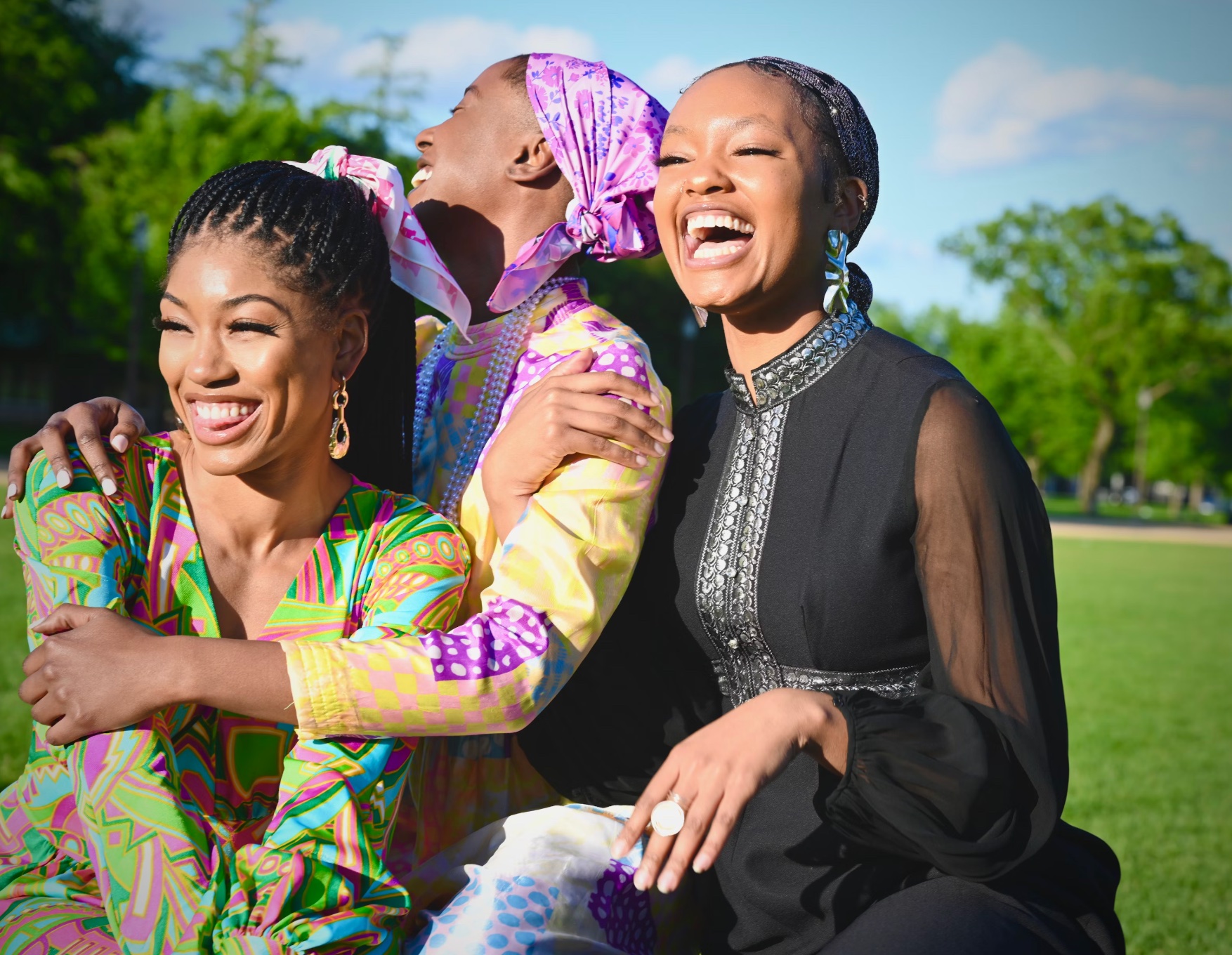 Three joyful women outdoors enjoying energy and clarity during follicular phase